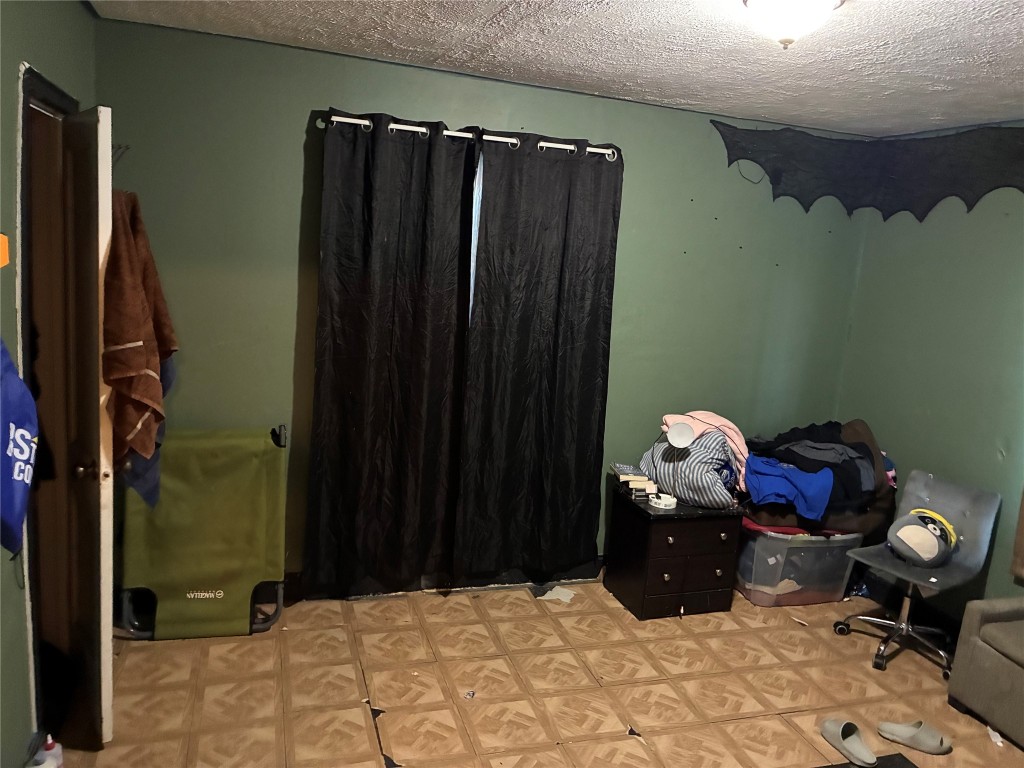 5404 Starling Street Houston, TX 77017 - Photo 9 of 21 a bed room with a bed and a television