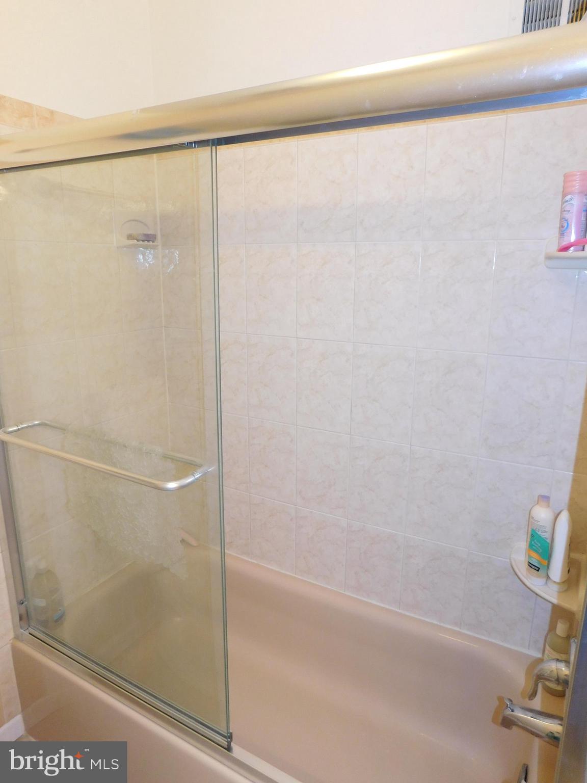 2424 Ansdel Court Reston, VA 20191 - Photo 20 of 25 Hall bath tub with newer glass doors