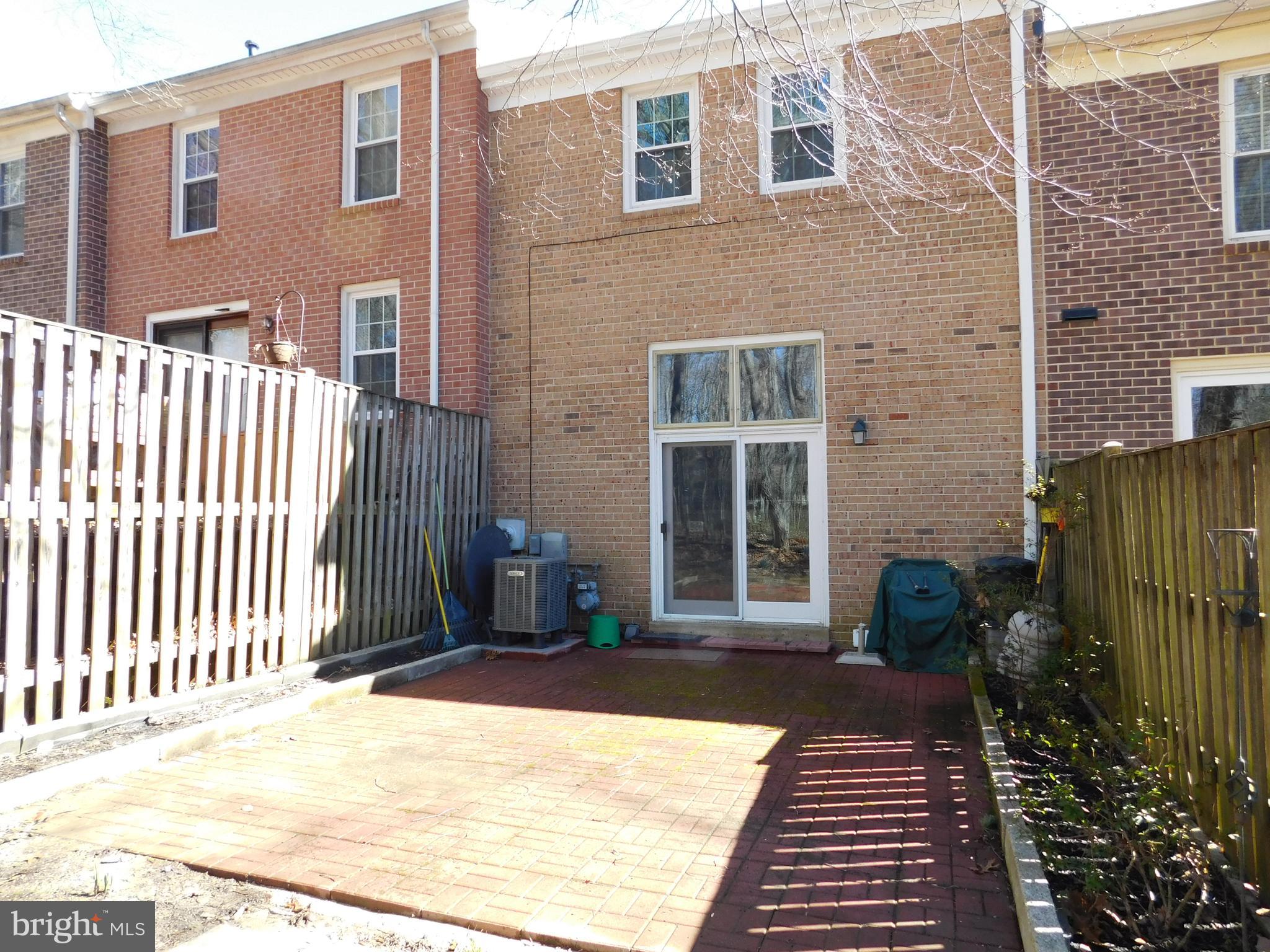 2424 Ansdel Court Reston, VA 20191 - Photo 23 of 25 Beautiful paver patio and new sliding glass doors