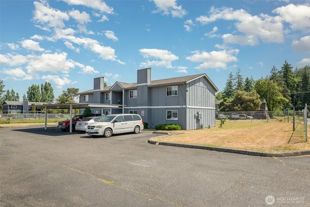 a view of street with parked cars