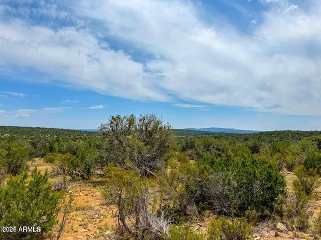 a view of a lake with houses in the back