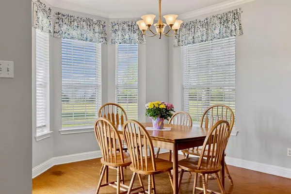 a dining room with furniture and window