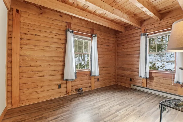 a view of front door of house with wooden floor