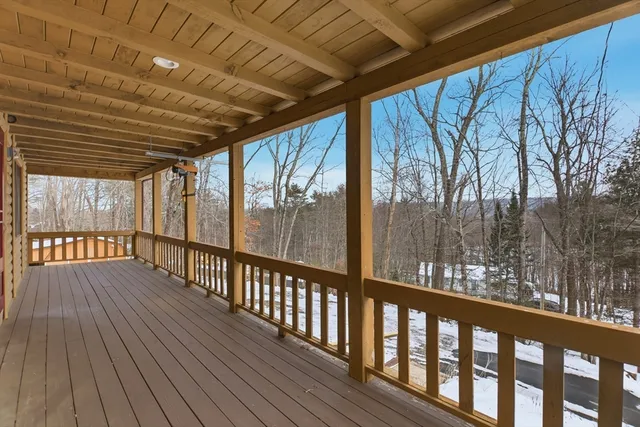 a view of porch with wooden floor