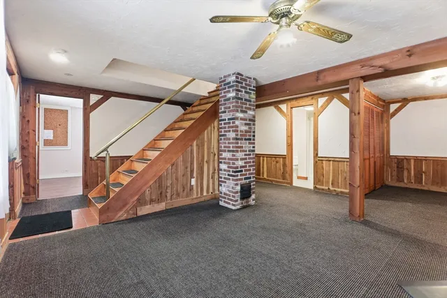 a view of an empty room with stairs
