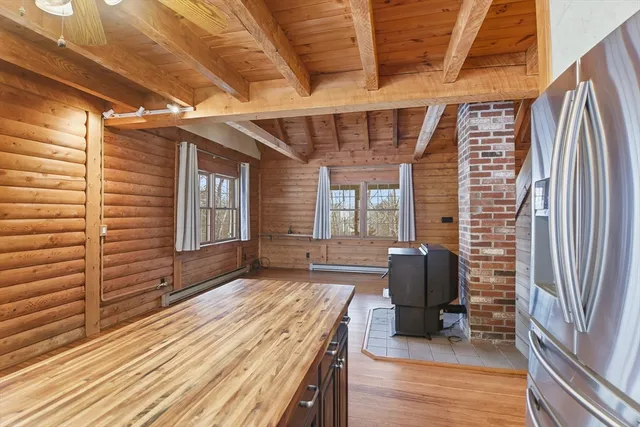 a view of a livingroom with furniture and a window