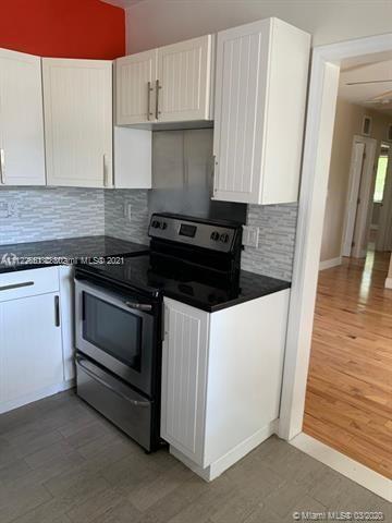 260 Northeast 48th Terrace Miami, FL 33137 - Photo 13 of 14 a stove top oven sitting inside of a kitchen