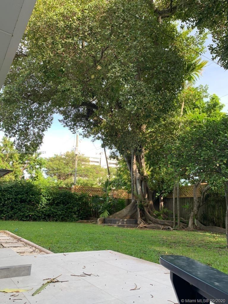 260 Northeast 48th Terrace Miami, FL 33137 - Photo 6 of 14 an outdoor space with green field and trees