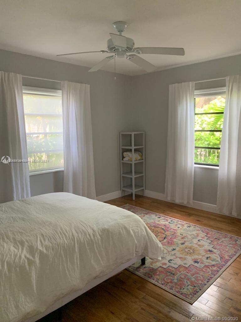 260 Northeast 48th Terrace Miami, FL 33137 - Photo 7 of 14 a bedroom with a bed and a window