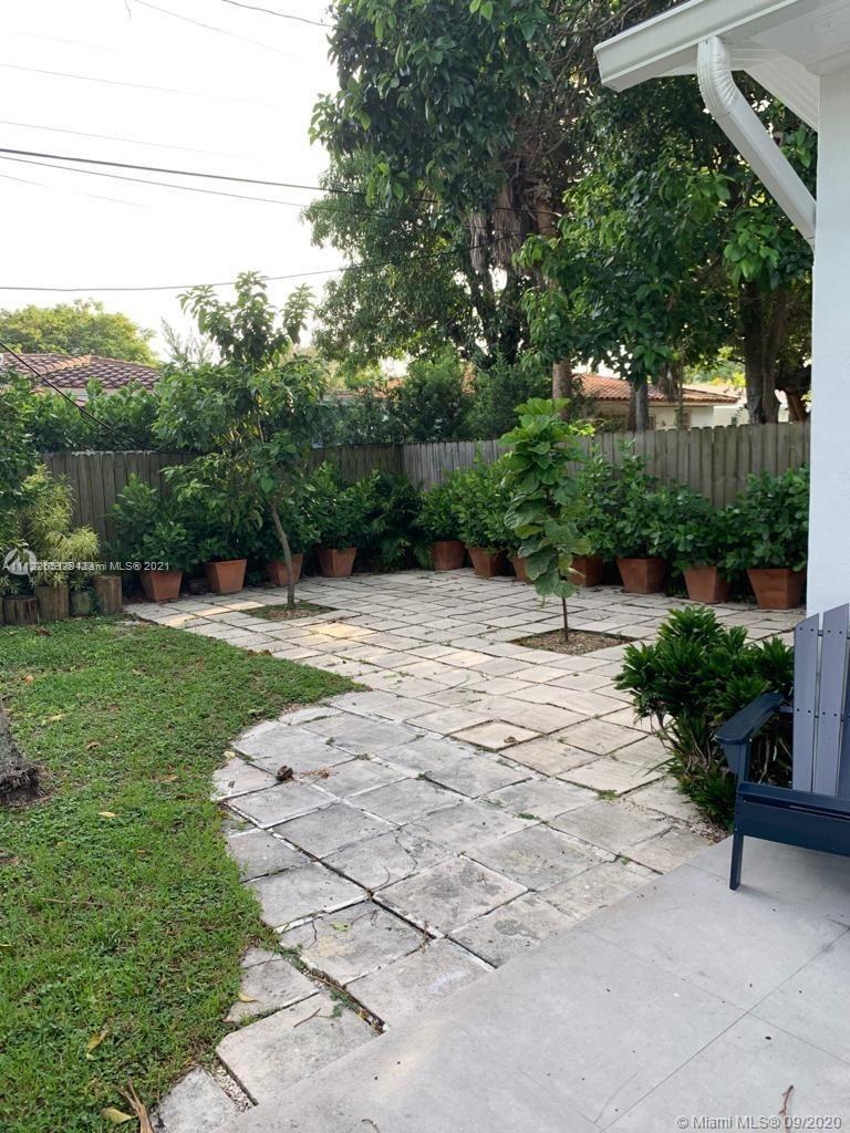 260 Northeast 48th Terrace Miami, FL 33137 - Photo 9 of 14 a backyard of a house with lots of green space