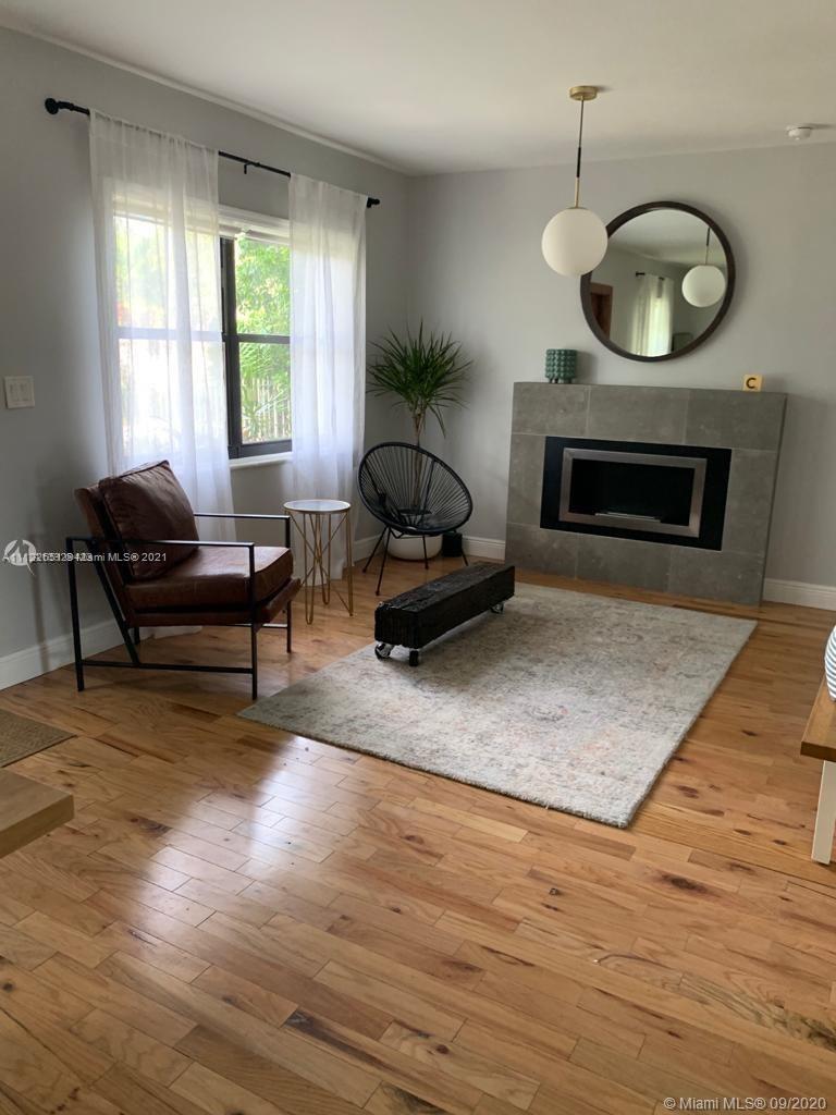 260 Northeast 48th Terrace Miami, FL 33137 - Photo 10 of 14 a living room with furniture and a fireplace