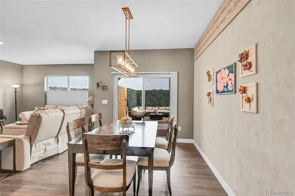 a view of a dining room with furniture window and wooden floor