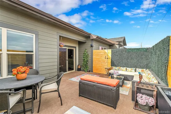a outdoor living space with furniture and potted plants