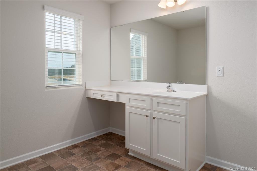 1215 Culver Spring Way Charlotte, NC 28215 - Photo 13 of 13 a room with a sink cabinets and a window