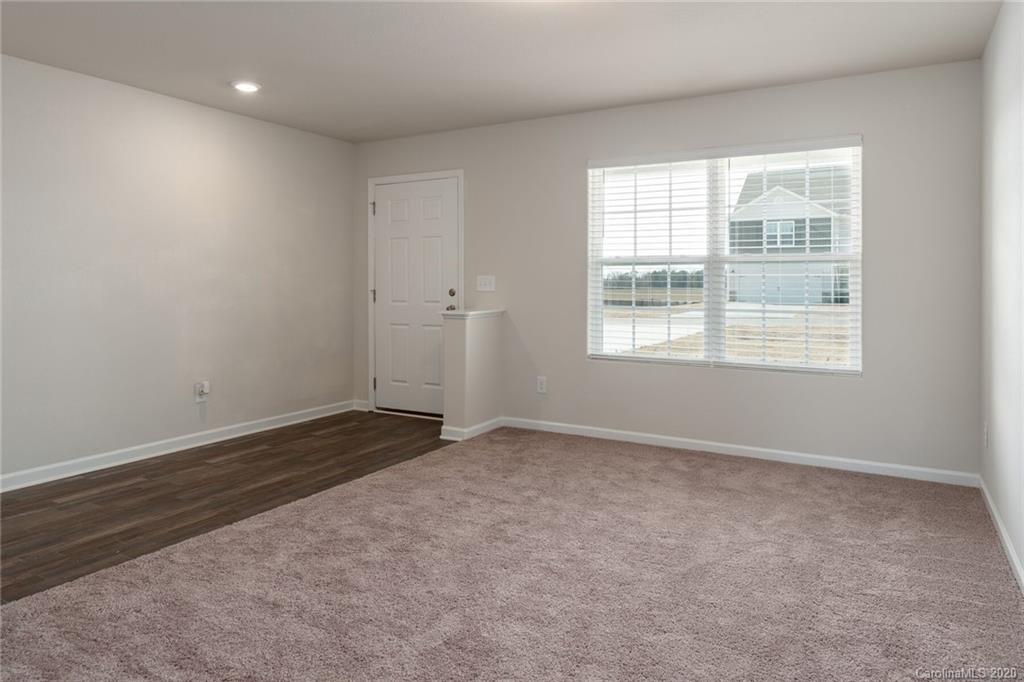 1215 Culver Spring Way Charlotte, NC 28215 - Photo 3 of 13 a view of an empty room with a window