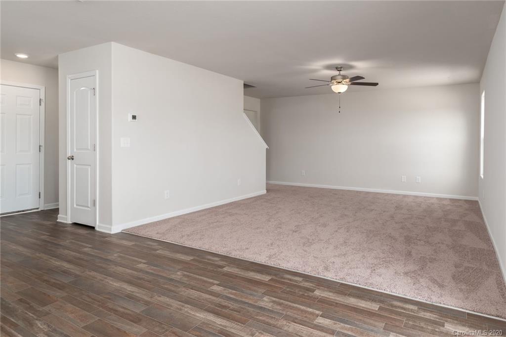 1215 Culver Spring Way Charlotte, NC 28215 - Photo 6 of 13 a view of empty room with wooden floor and fan