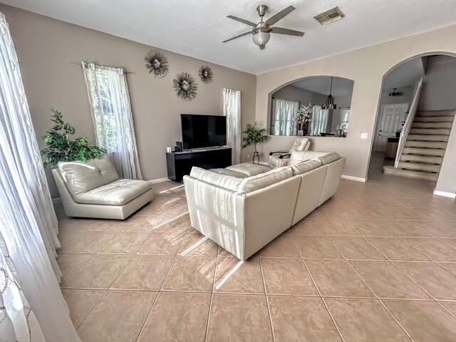 673 Gazetta Way West Palm Beach, FL 33413 - Photo 11 of 35 a living room with furniture and a flat screen tv