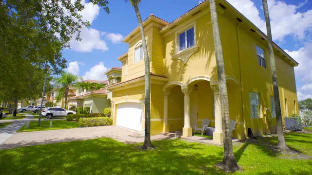 a view of a building with a yard