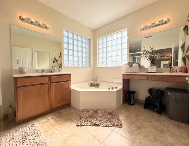 a bathroom with a sink toilet bathtub and mirror