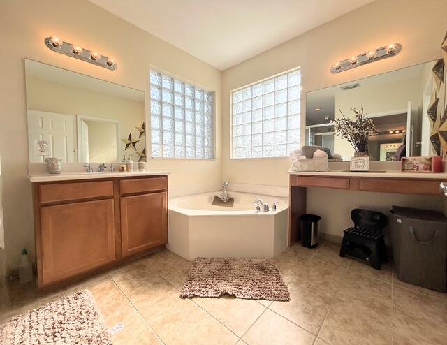 673 Gazetta Way West Palm Beach, FL 33413 - Photo 26 of 35 a bathroom with a sink toilet bathtub and mirror