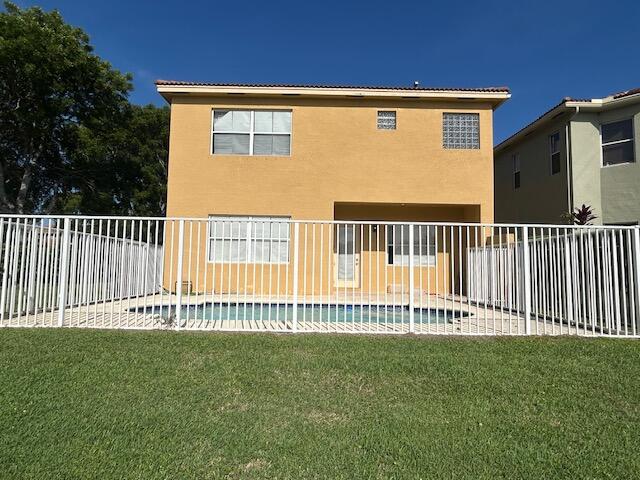 673 Gazetta Way West Palm Beach, FL 33413 - Photo 3 of 35 a view of a house with a garden