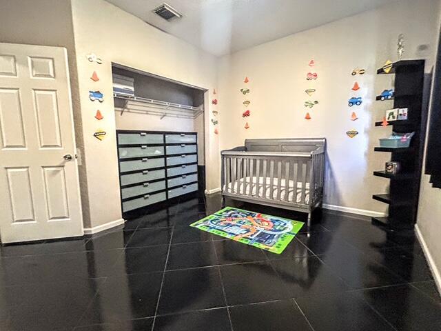 673 Gazetta Way West Palm Beach, FL 33413 - Photo 33 of 35 a bedroom with a bed and a window