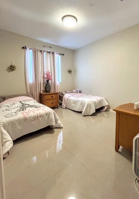 673 Gazetta Way West Palm Beach, FL 33413 - Photo 34 of 35 a bedroom with bed and window