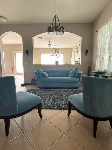 673 Gazetta Way West Palm Beach, FL 33413 - Photo 9 of 35 a living room with furniture and a chandelier