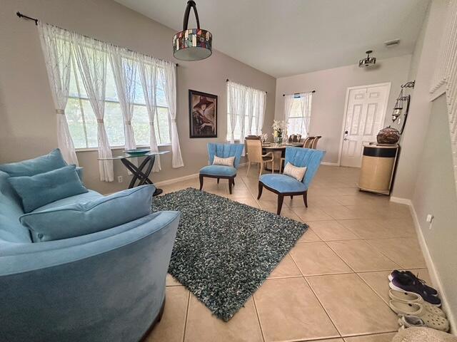 673 Gazetta Way West Palm Beach, FL 33413 - Photo 10 of 35 a living room with furniture and a window