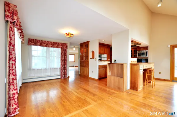 a view of kitchen with furniture and floor to ceiling window