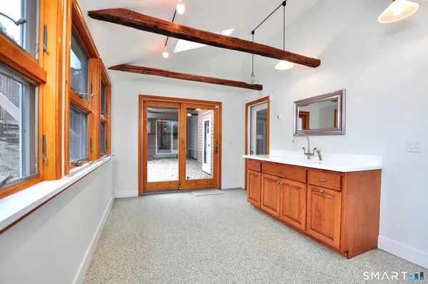 a large bathroom with a sink and a large mirror
