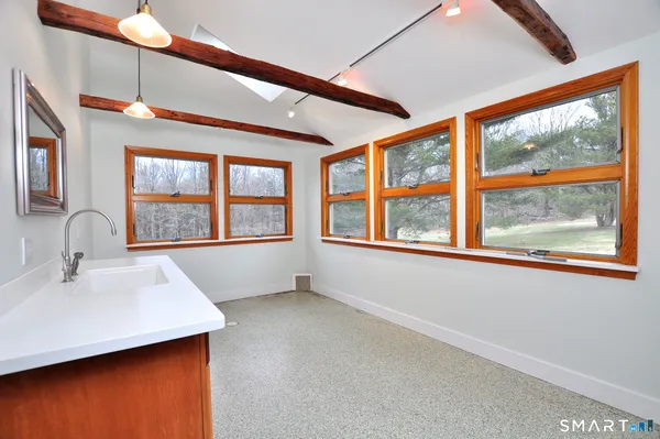 a bathroom with a sink and a large window