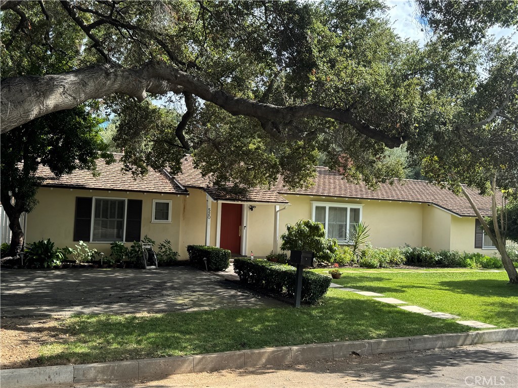 a front view of house with yard and outdoor seating