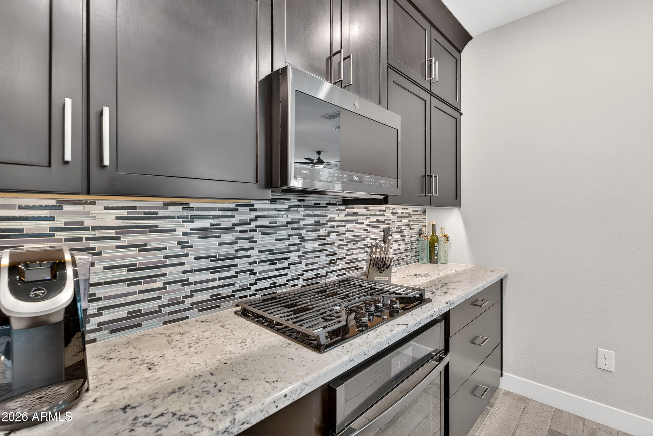3855 South McQueen Road, Unit 59 Chandler, AZ 85286 - Photo 14 of 56 a bathroom with a stove a sink and a microwave