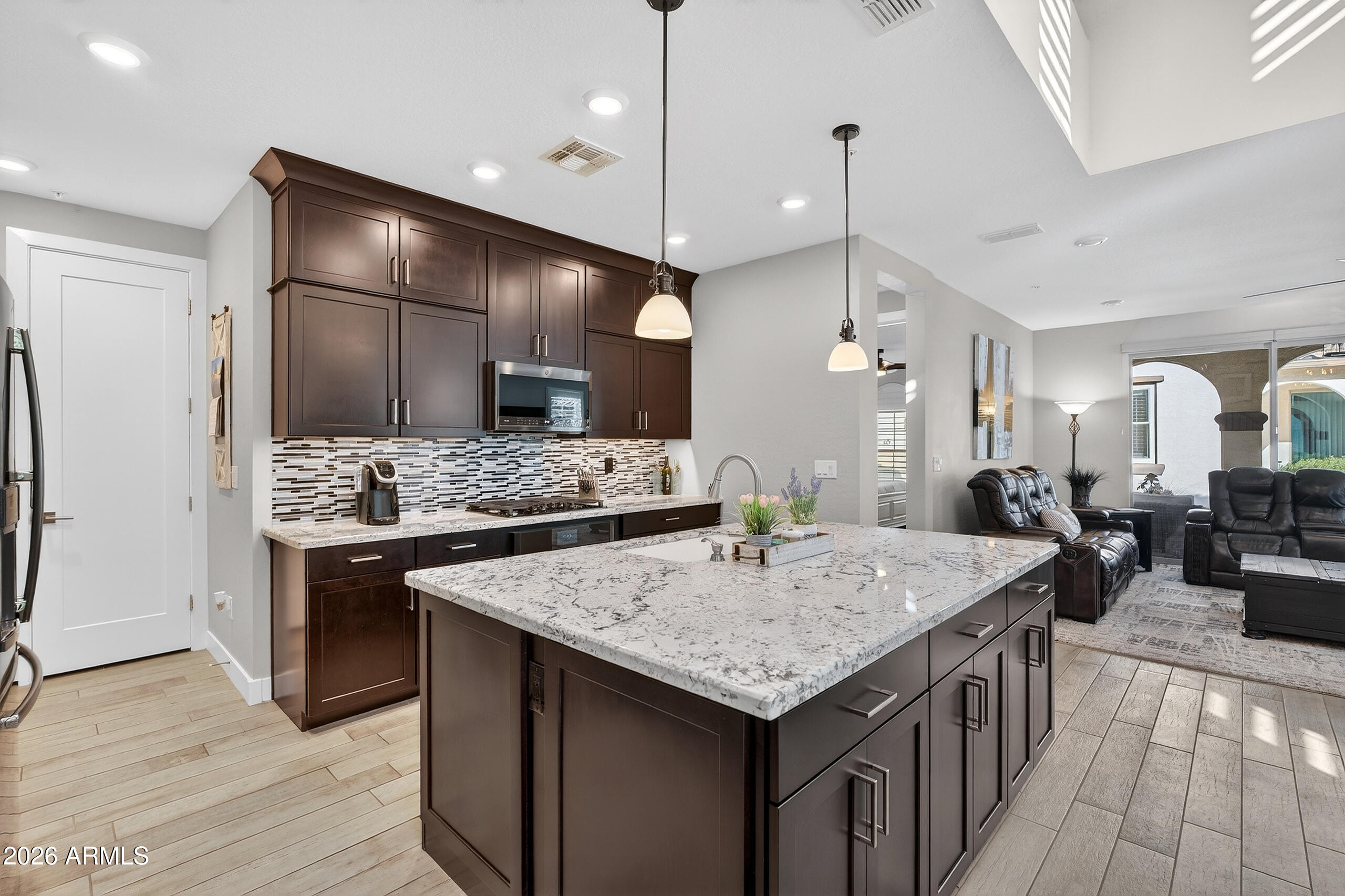 3855 South McQueen Road, Unit 59 Chandler, AZ 85286 - Photo 15 of 56 a kitchen with a counter space wooden cabinets and refrigerator