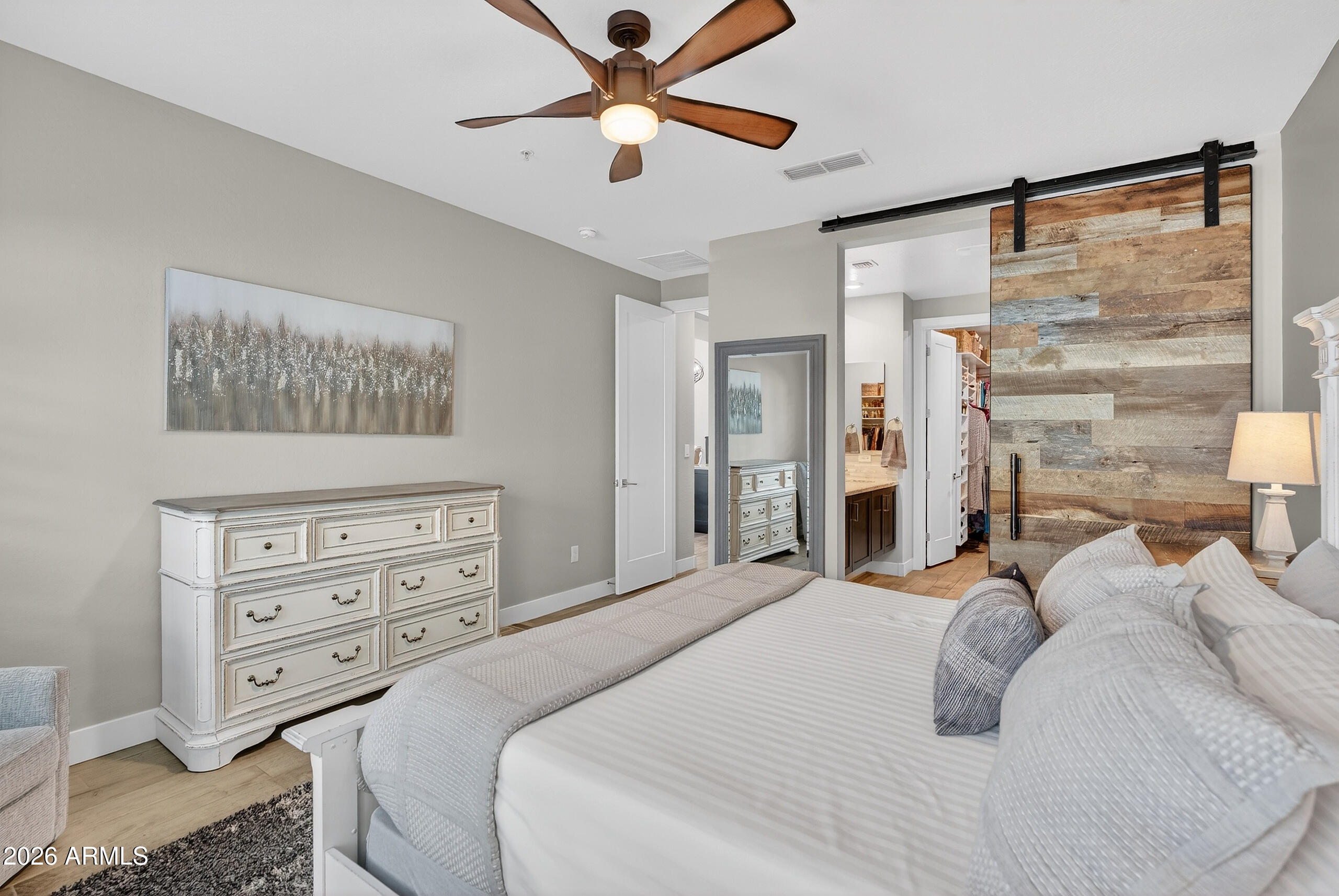 3855 South McQueen Road, Unit 59 Chandler, AZ 85286 - Photo 20 of 56 a bedroom with a bed and a chandelier