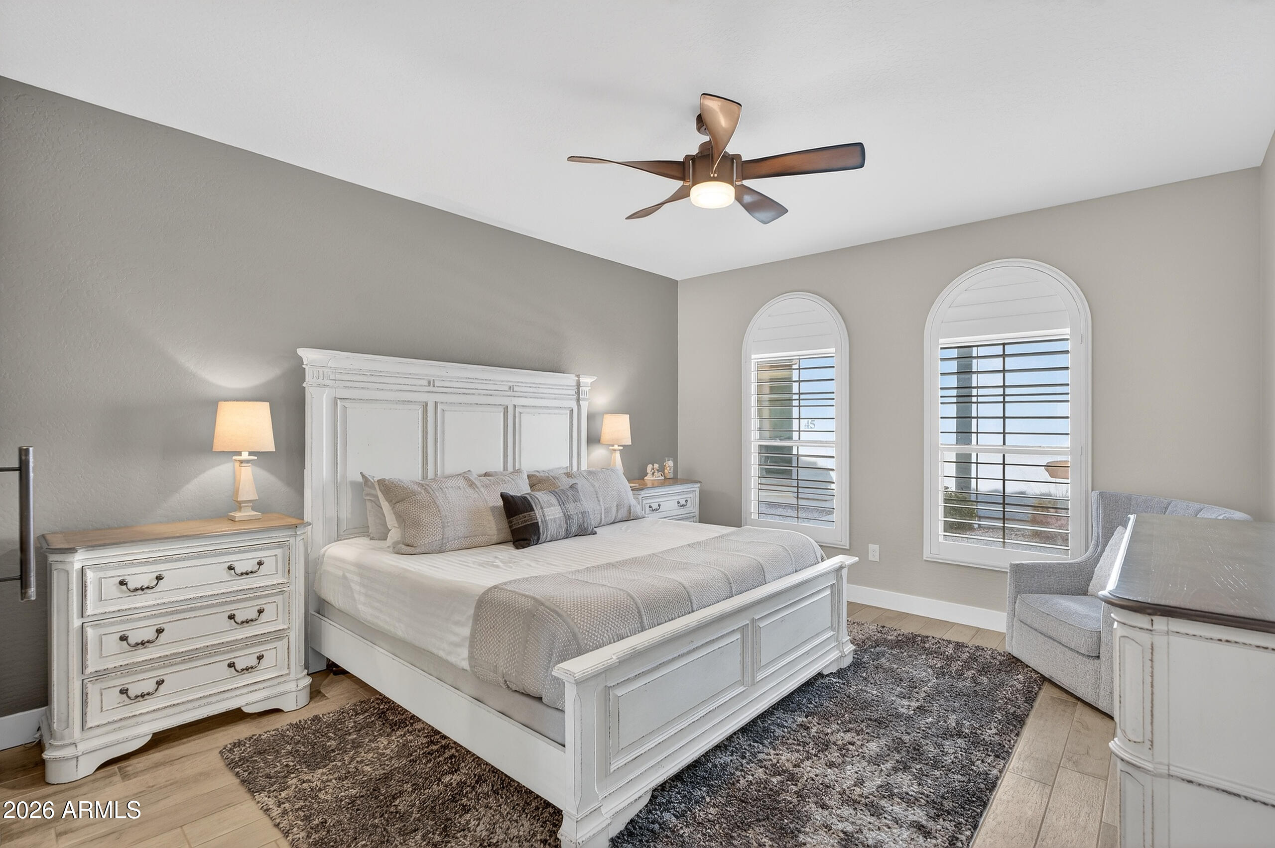 3855 South McQueen Road, Unit 59 Chandler, AZ 85286 - Photo 22 of 56 a bedroom with a large bed and a chandelier