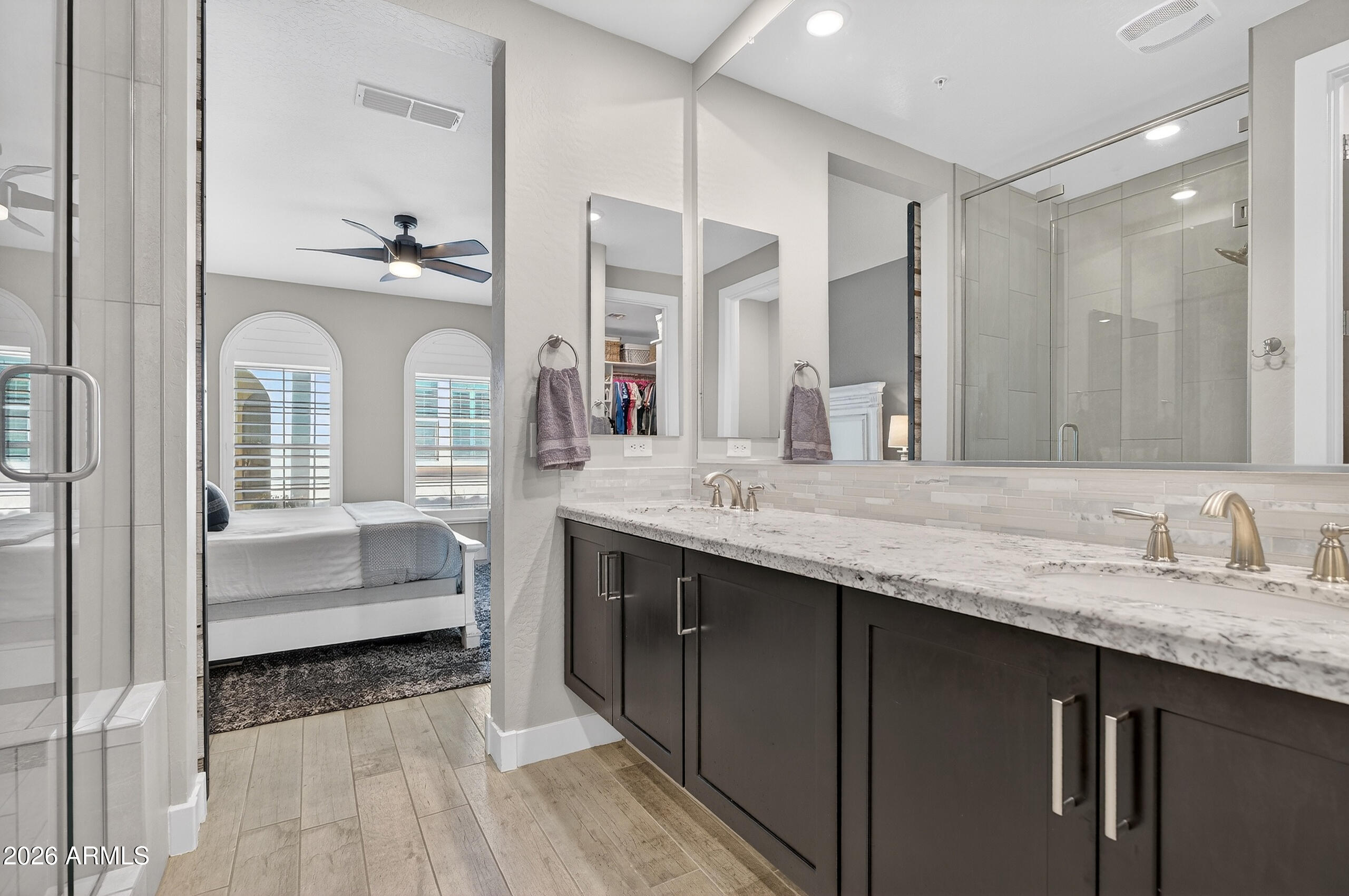 3855 South McQueen Road, Unit 59 Chandler, AZ 85286 - Photo 23 of 56 a en suite bathroom with a granite countertop tub sink and mirror
