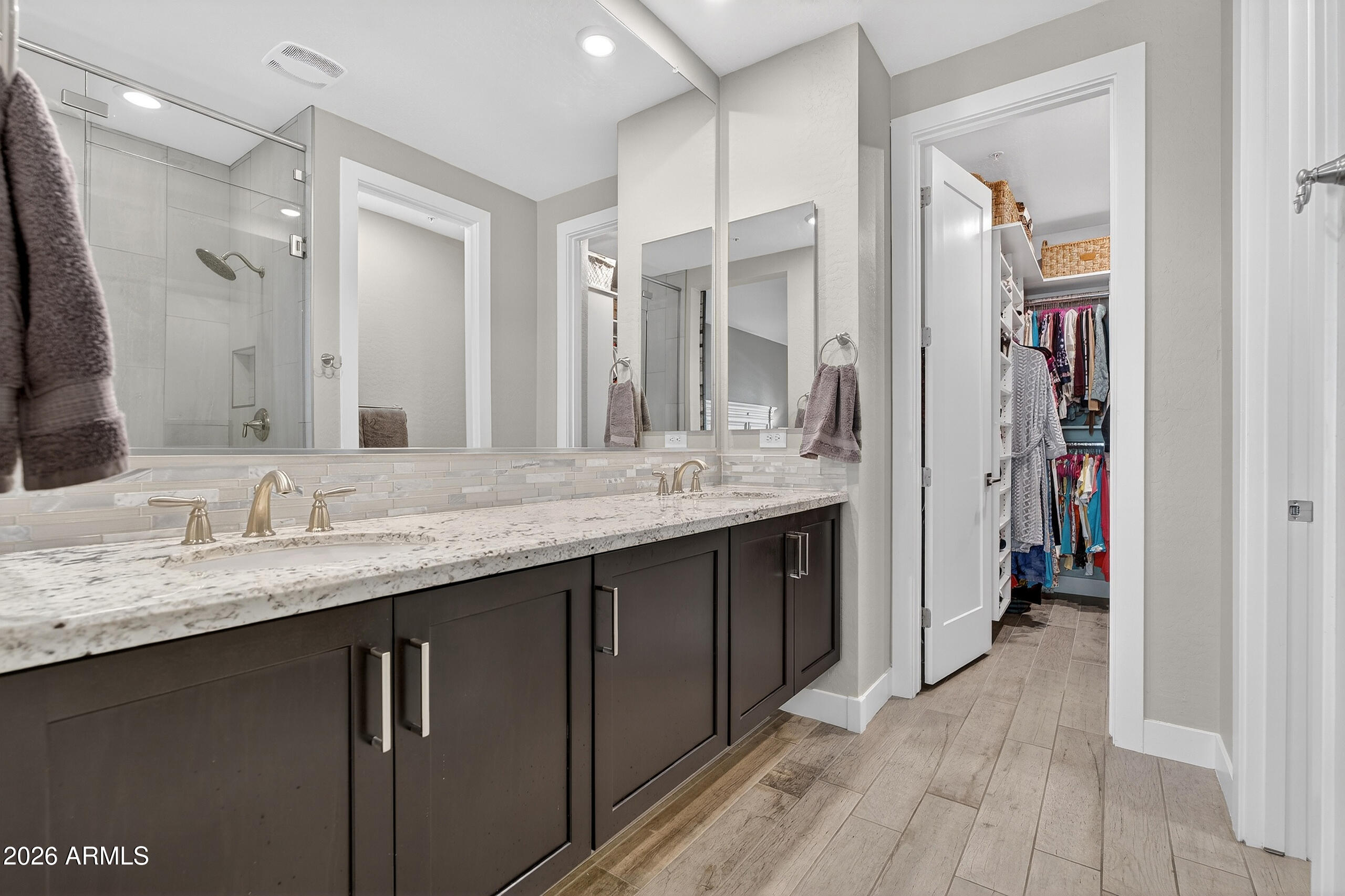 3855 South McQueen Road, Unit 59 Chandler, AZ 85286 - Photo 24 of 56 a bathroom with a granite countertop sink a mirror and a