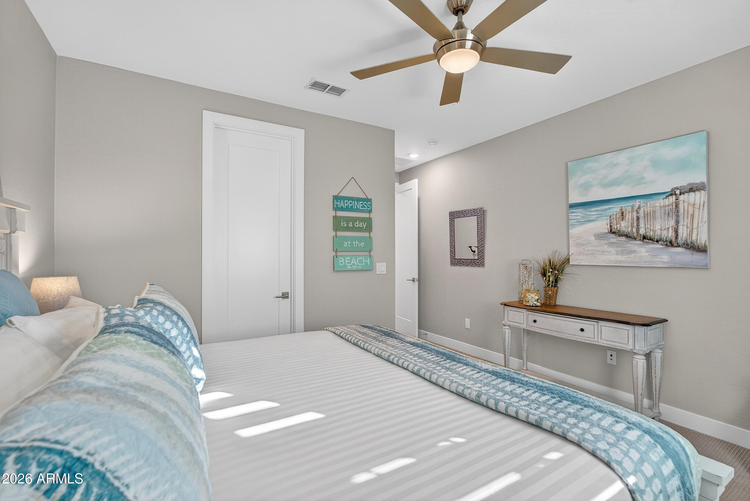 3855 South McQueen Road, Unit 59 Chandler, AZ 85286 - Photo 33 of 56 a bedroom with a bed and a chandelier