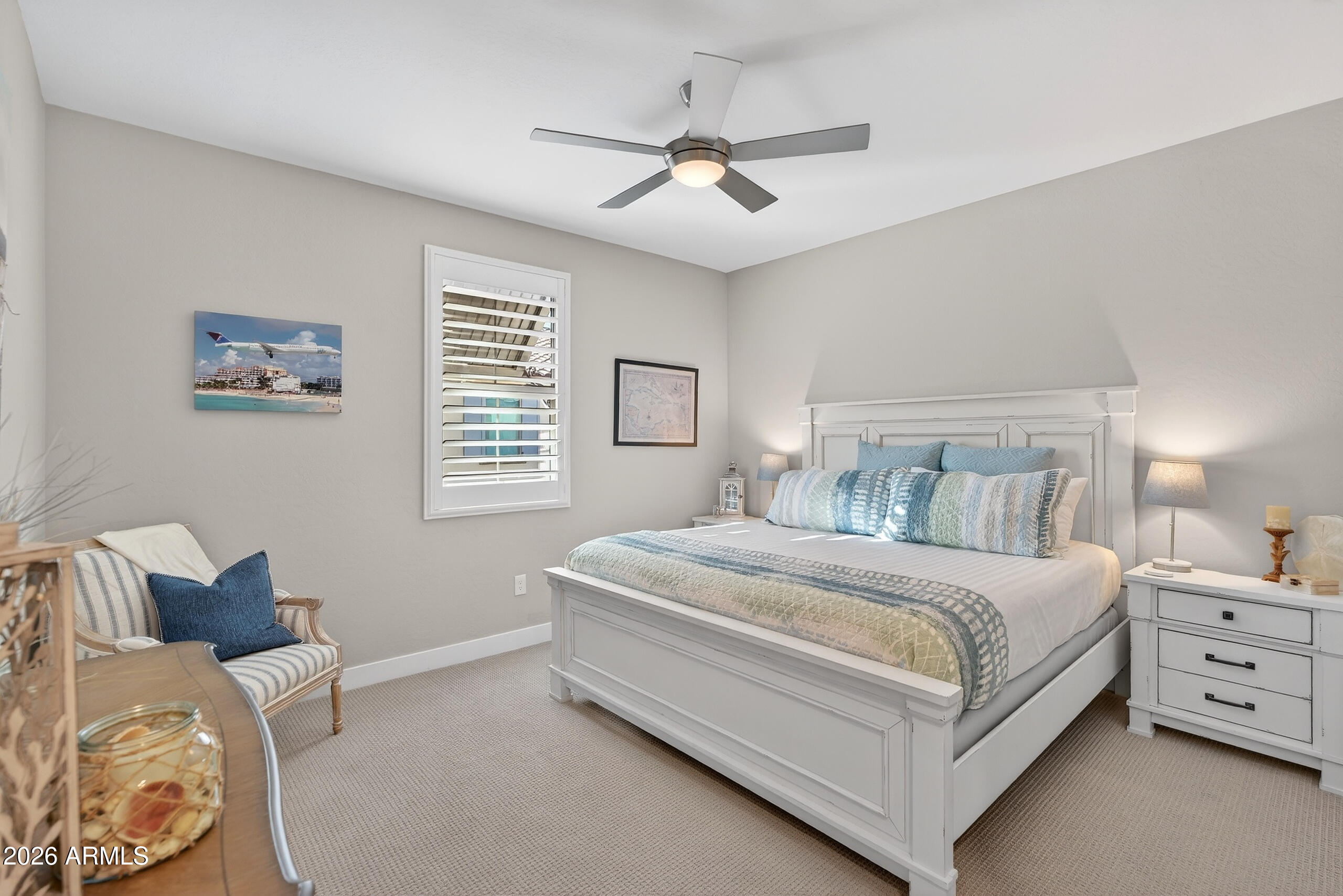 3855 South McQueen Road, Unit 59 Chandler, AZ 85286 - Photo 34 of 56 a bedroom with a bed and a chandelier