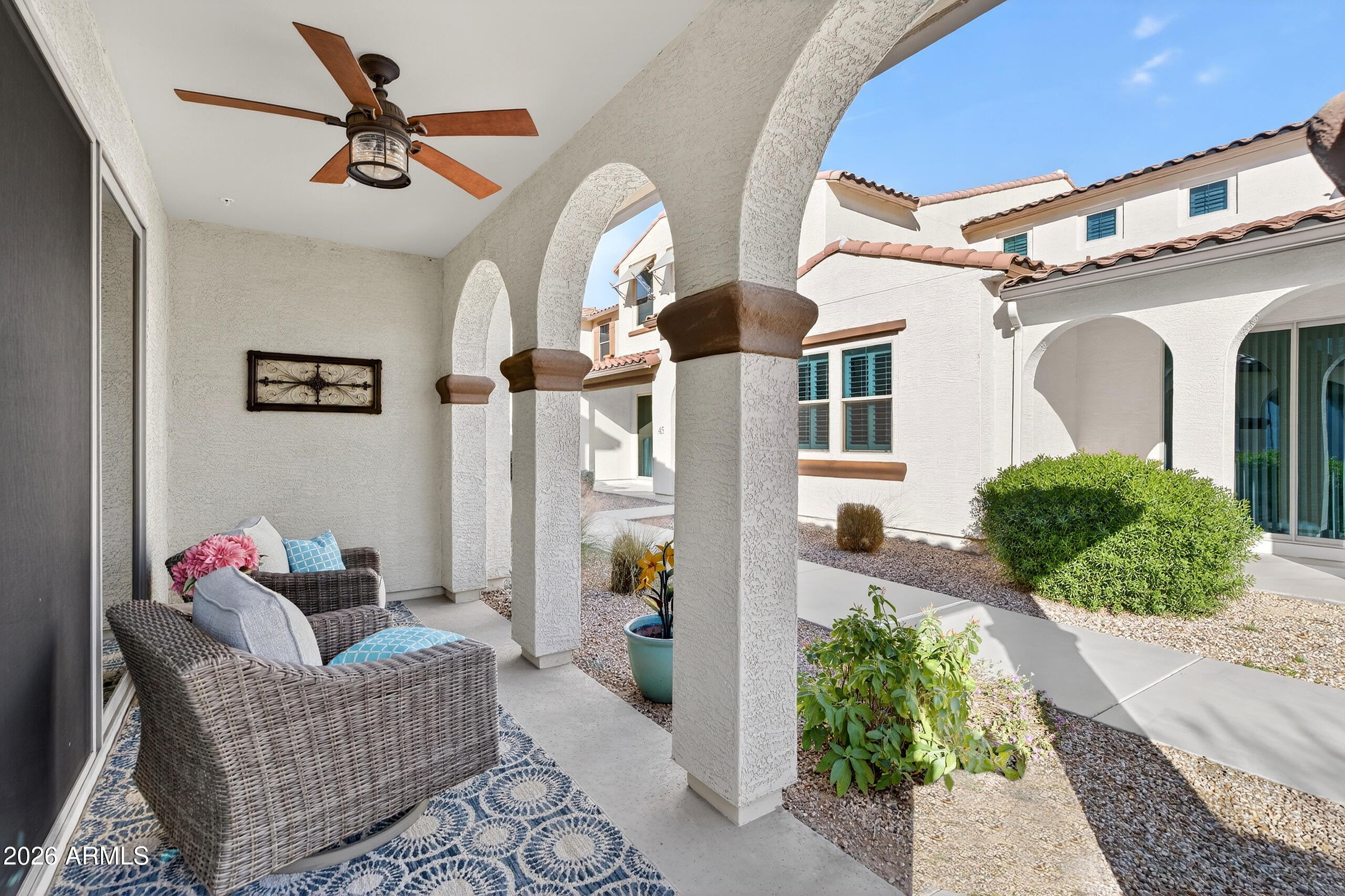 3855 South McQueen Road, Unit 59 Chandler, AZ 85286 - Photo 41 of 56 a living room with furniture and a chandelier