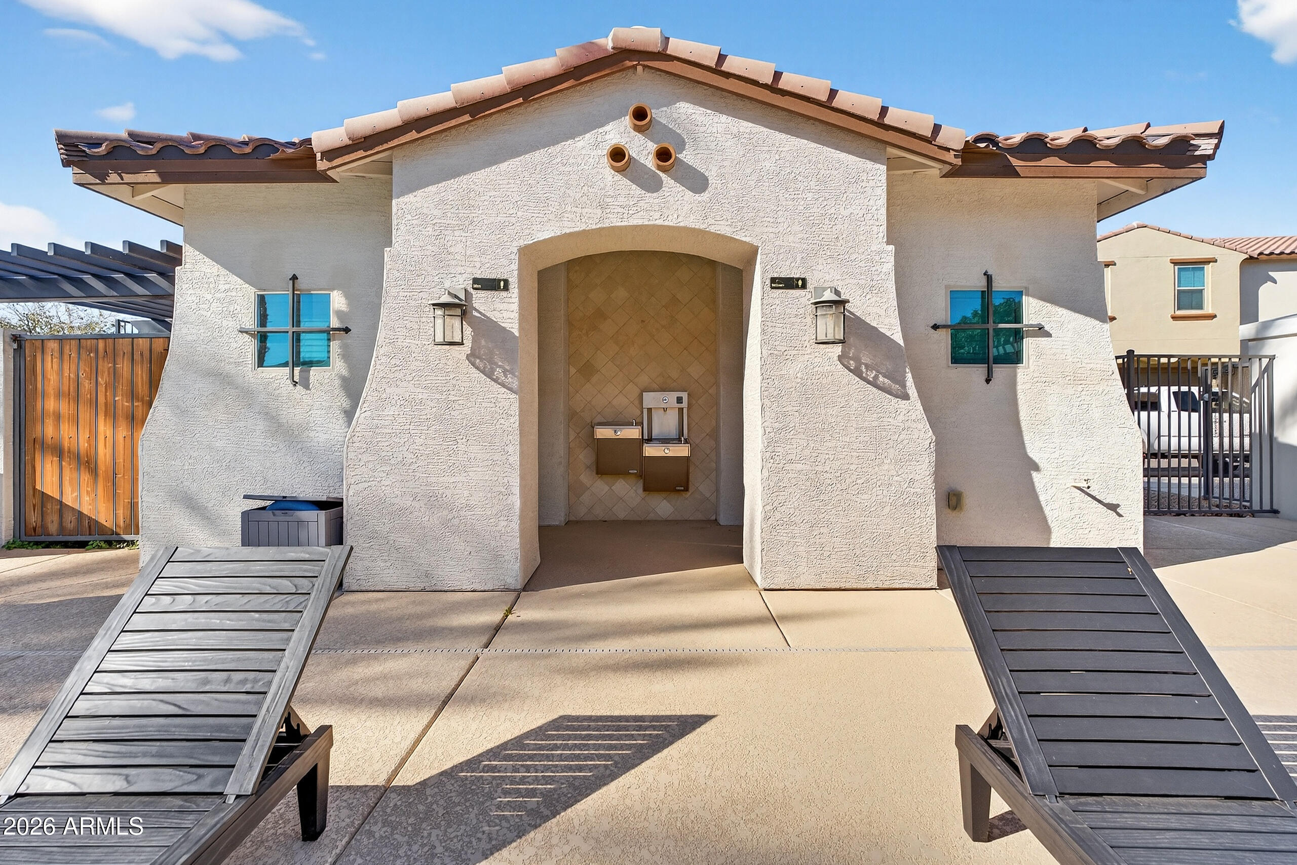 3855 South McQueen Road, Unit 59 Chandler, AZ 85286 - Photo 48 of 56 a view of a white house with large windows