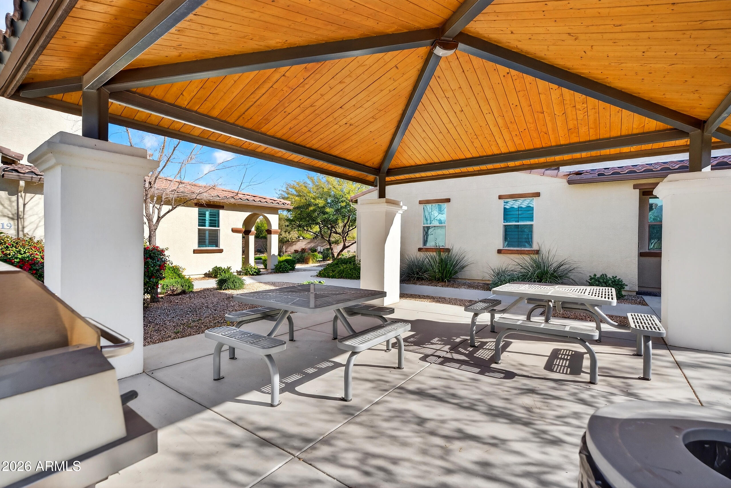 3855 South McQueen Road, Unit 59 Chandler, AZ 85286 - Photo 52 of 56 a view of backyard with outdoor seating and plants