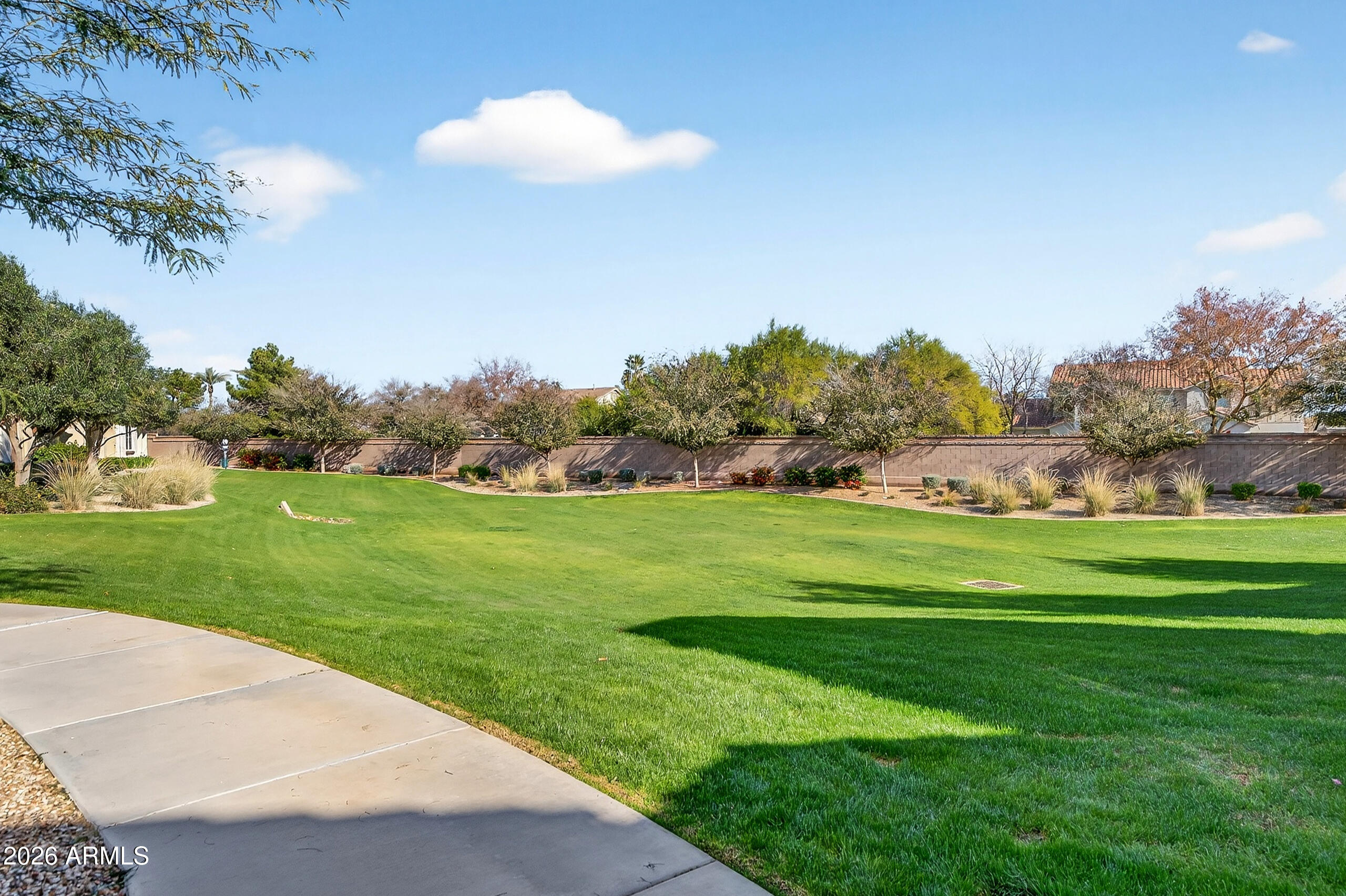 3855 South McQueen Road, Unit 59 Chandler, AZ 85286 - Photo 54 of 56 a view of a golf course with a lake