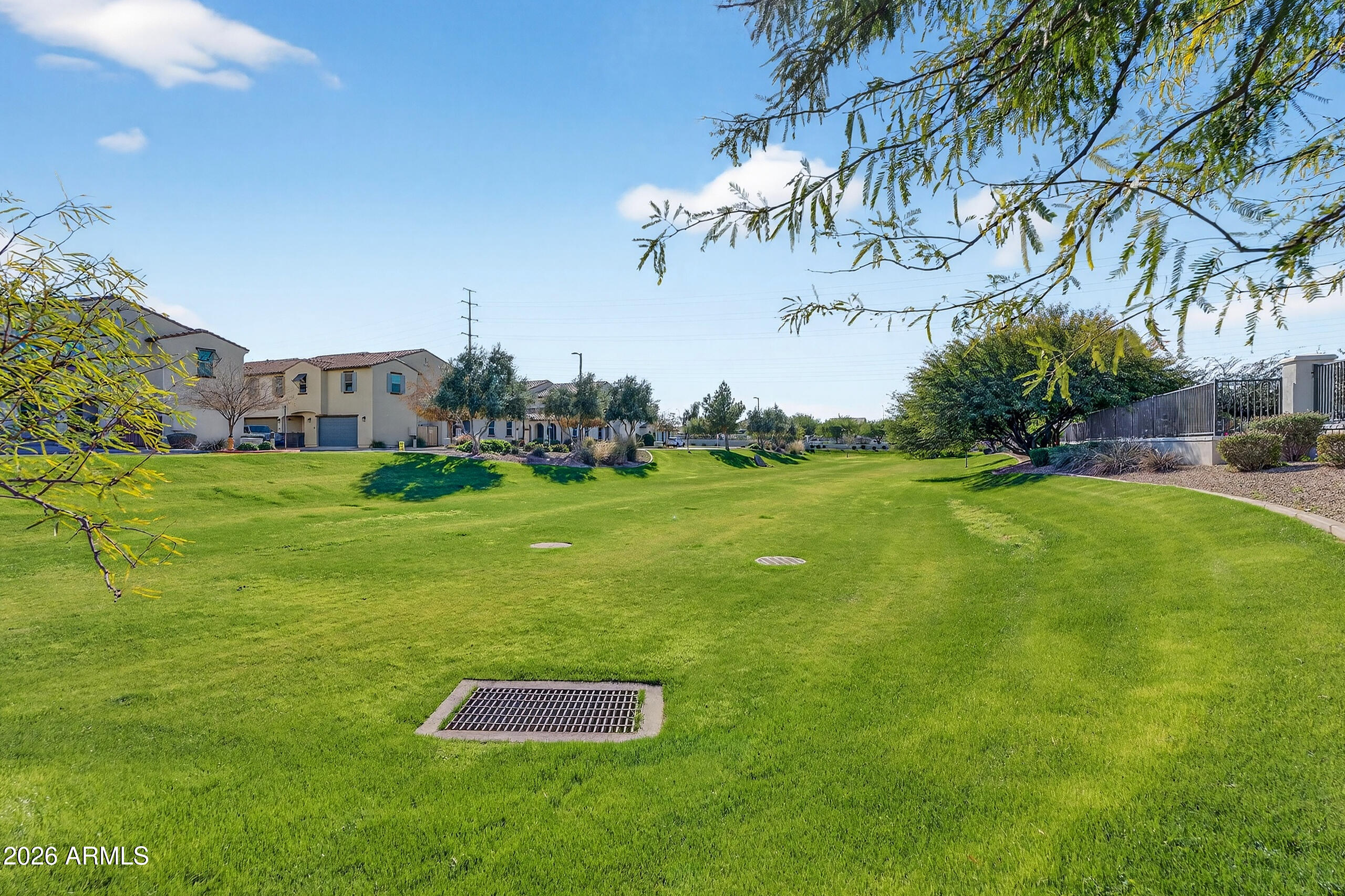 3855 South McQueen Road, Unit 59 Chandler, AZ 85286 - Photo 56 of 56 a big yard with palm trees