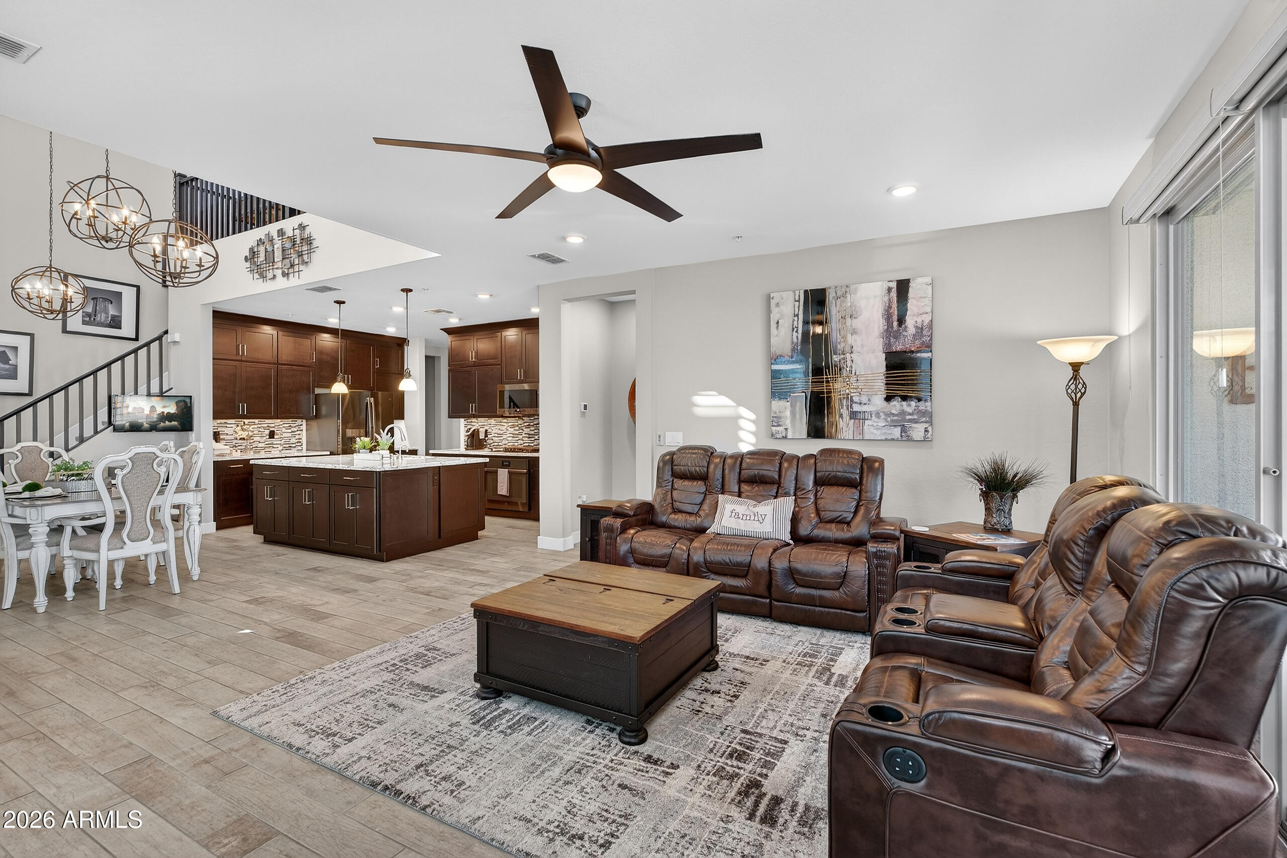 3855 South McQueen Road, Unit 59 Chandler, AZ 85286 - Photo 6 of 56 a living room with furniture kitchen area and a ceiling fan