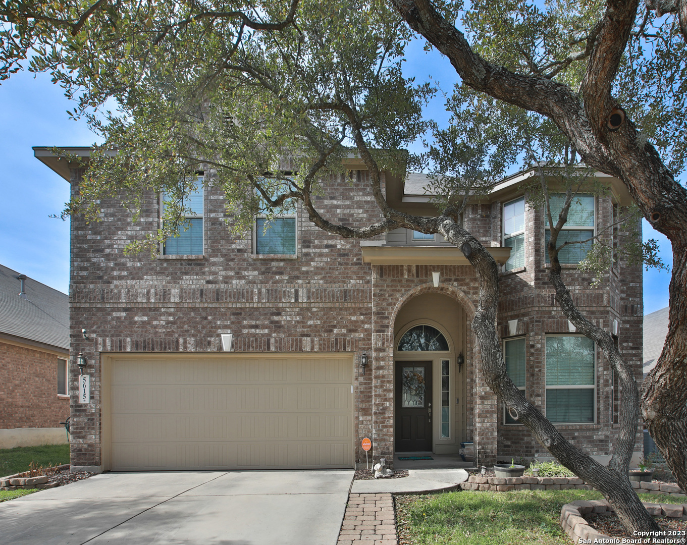 a front view of a house with yard