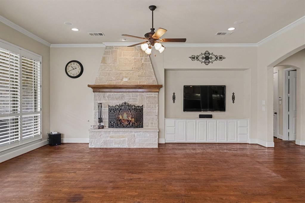 Stone fireplace with a wood mantel