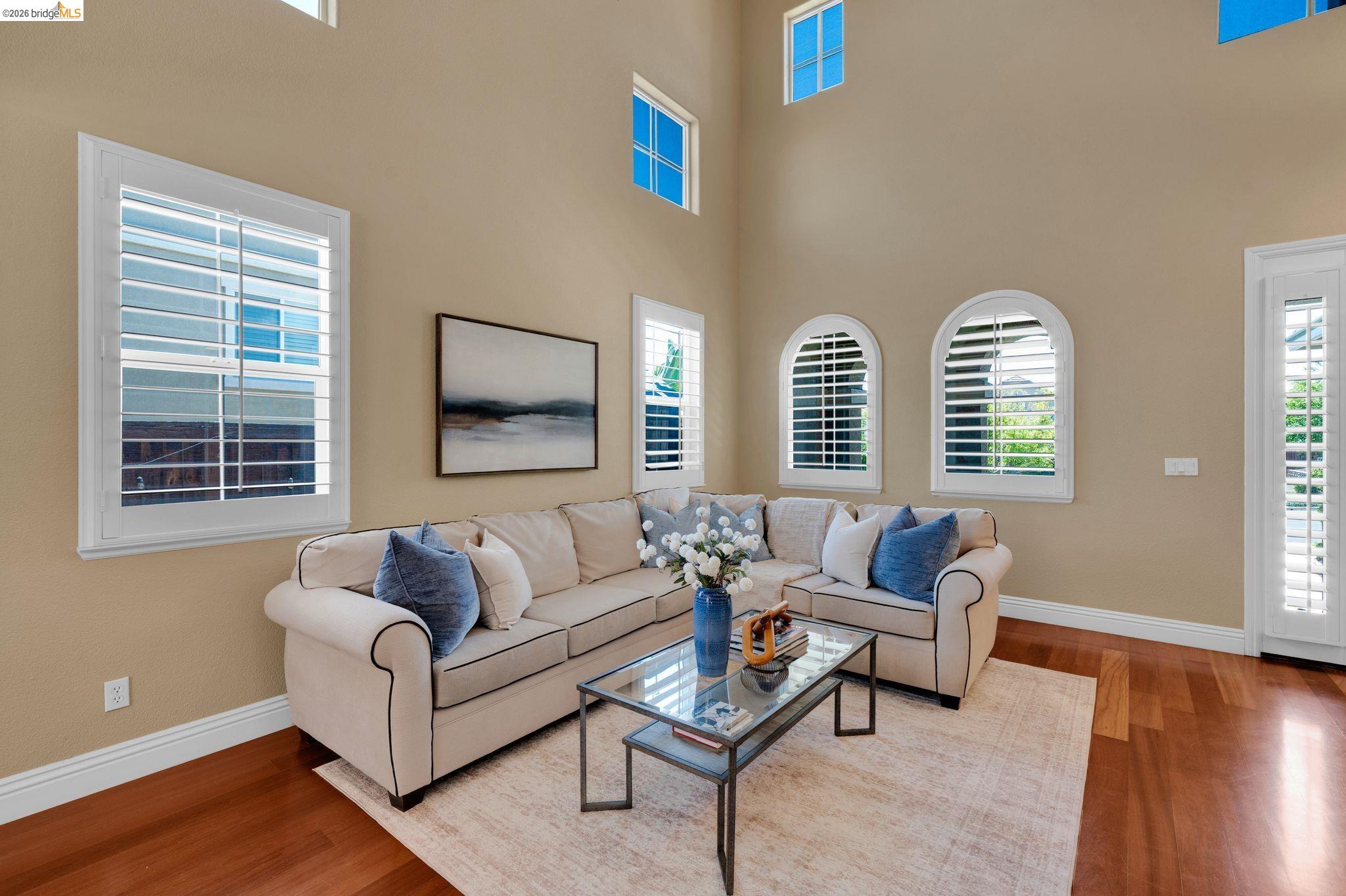 2513 Winged Foot Road Brentwood, CA 94513 - Photo 4 of 45 Vaulted ceilings with high transom windows and arched windows featuring plantation shutters